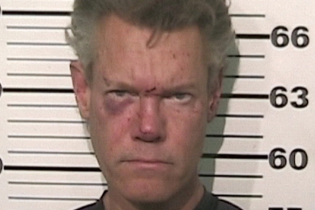 Randy Travis looking a little rough. Could his bender have started with a bar crawl? Who knows...